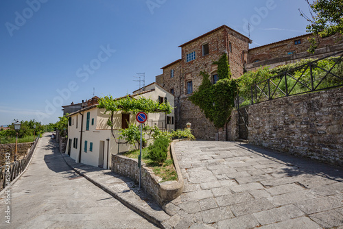 Lucignano, Italy - 23 of May 2022: Walking streets of small historic town Lucignano. photo