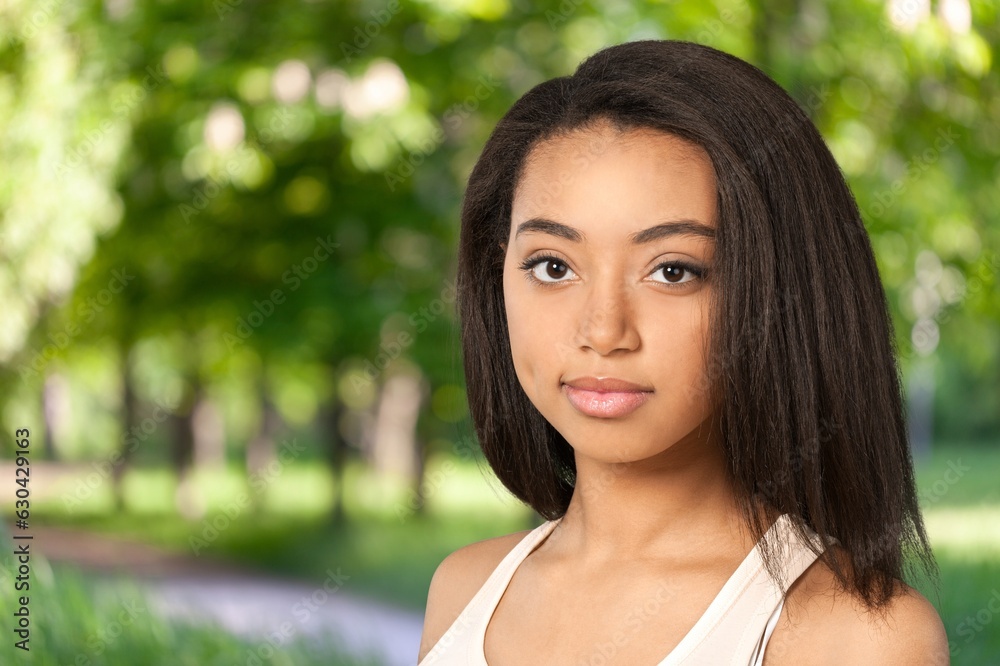 Portrait of smiling young woman posing outdoor Portrait of smiling young woman posing outdoor