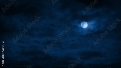 Fast Moving Clouds Over Full Moon photo