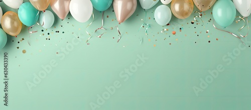 Obraz na płótnie a background image that features birthday balloons, confetti, and ribbons on a pastel green background. is taken from a top view and has enough space for additional text. It would be suitable for w salonie