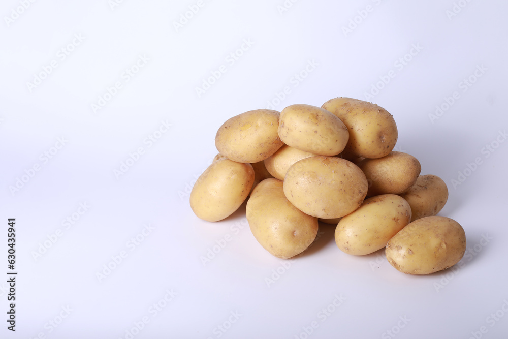 Raw potatoes on a white background
