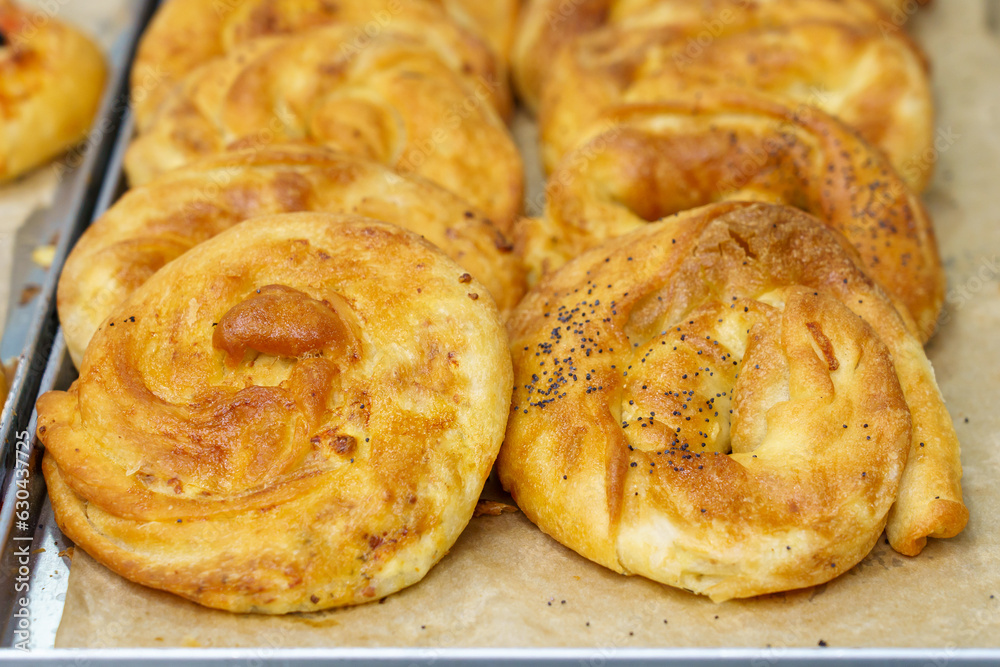 Baking from puff pastry, Vertuta or placinda. Appetizing pastries. Fast food. Snack from the bakery for a break. Baking from puff pastry, Vertuta or placinda. Appetizing pastries. Fast food. Snack from the bakery for a break.