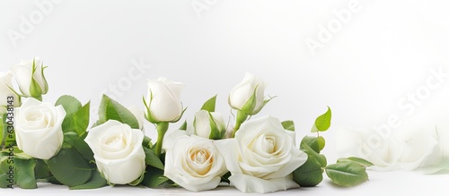 A banner for a website header design featuring a wedding bouquet of white roses on a white background with a soft focus. copy space available.