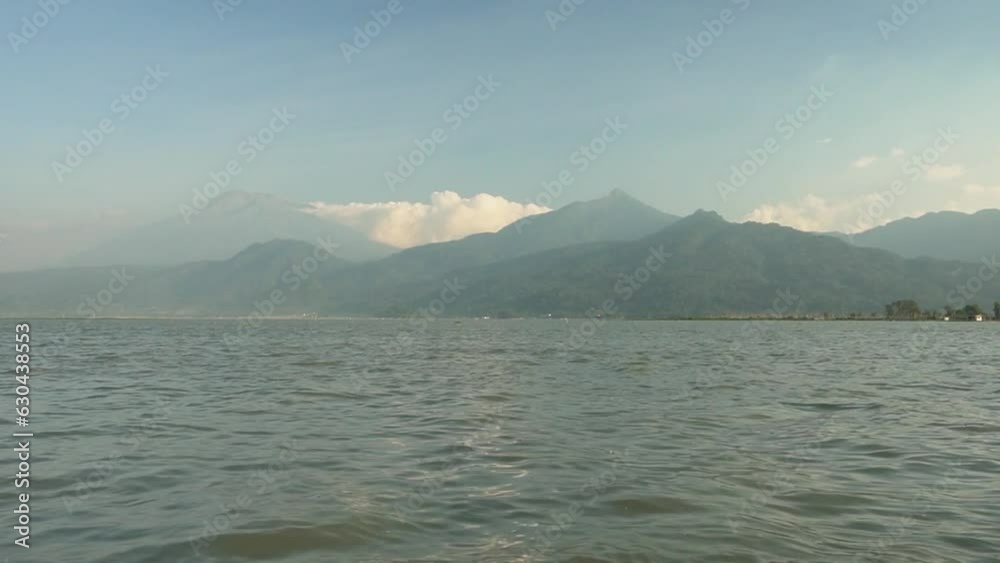 Ambarawa, Indonesia - July Tuesday 2023 : Mount Telomoyo from Lake Rawa Pening. Ambarawa, Indonesia - July Tuesday 2023 : Mount Telomoyo from Lake Rawa Pening.