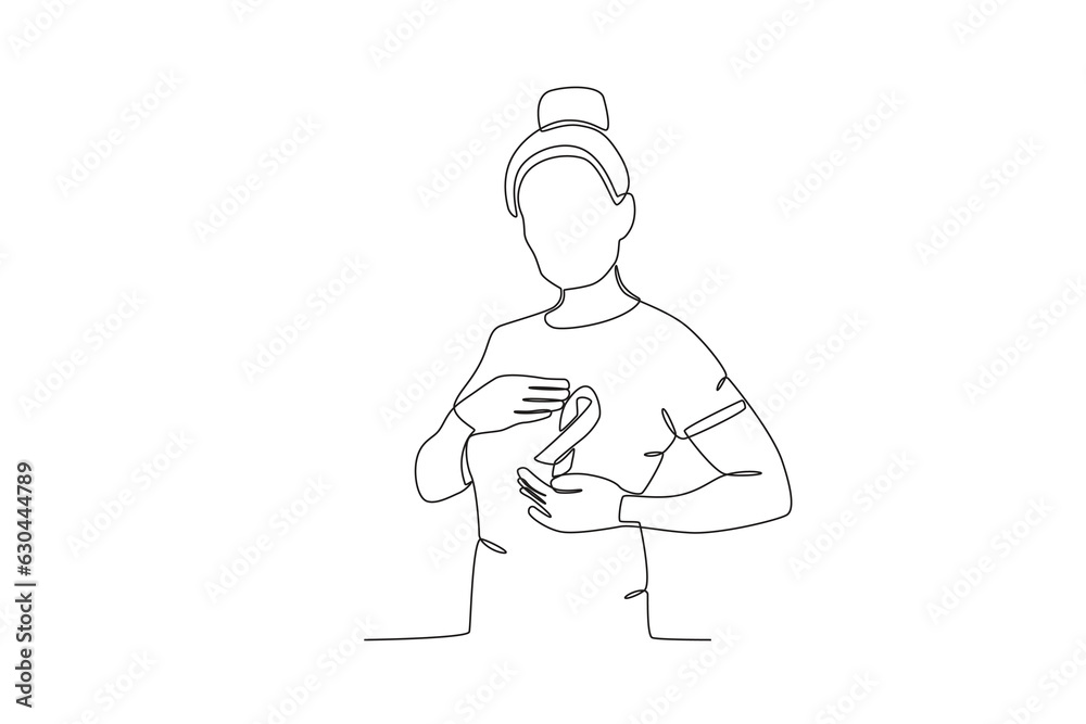 A woman shows a breast health support ribbon. Breast cancer awareness month one-line drawing A woman shows a breast health support ribbon. Breast cancer awareness month one-line drawing
