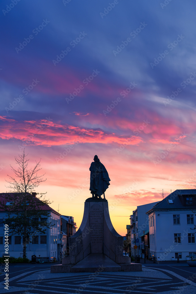 Monument statue of Leif Erikson, a famous Icelandic explorer in front of main entrain the Hallgrímskirkja church in the sunset