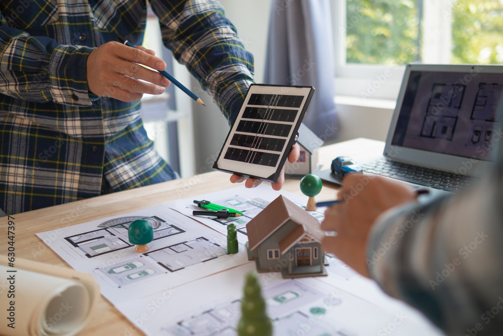 team of renewable energy engineers are talking to architects to make ...