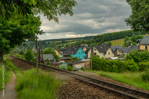 Railway tracks in summer cloudy day near Neudorf in Germany photo