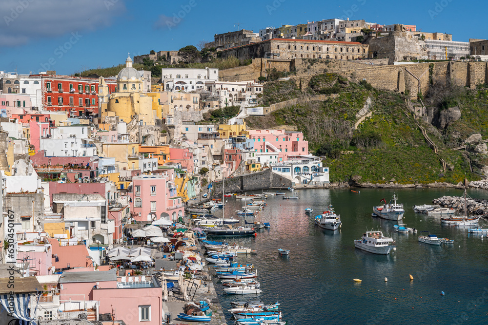 Naklejka premium Panoramic view of Corricella port, the most famous touristic landmark of Procida, Campania region, Italy