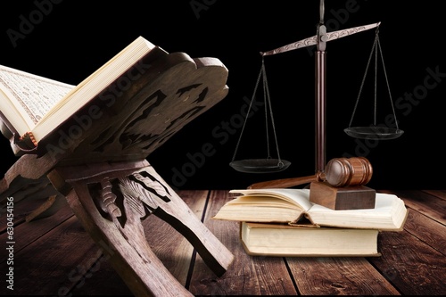 law concept, wooden gavel and holly koran photo