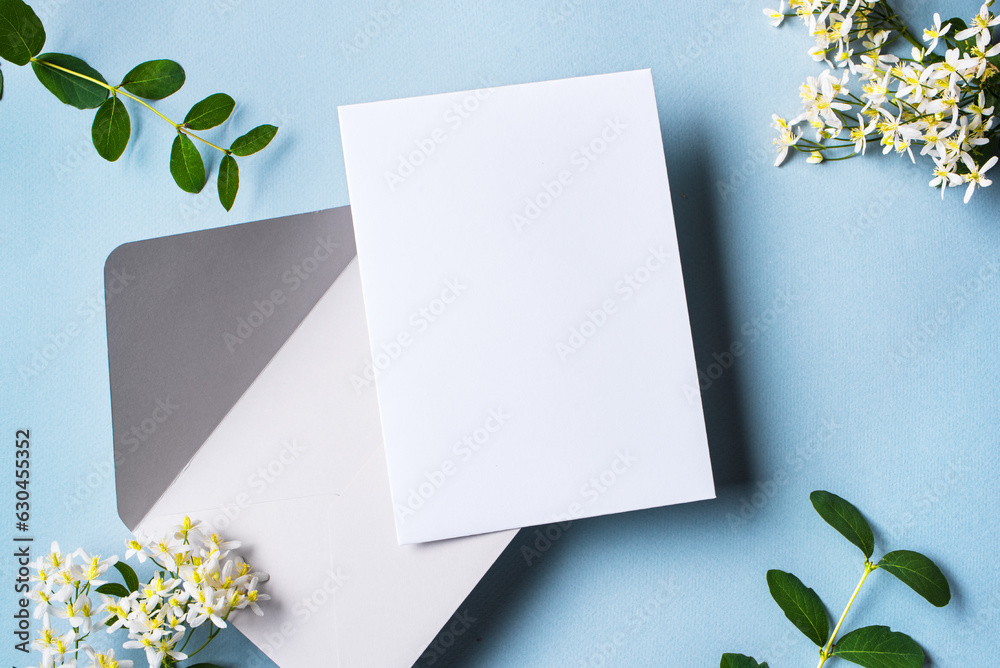 Greeting or invitation blank card and white flowers