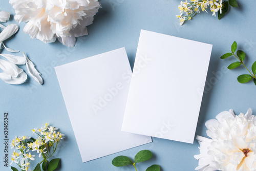Greeting or invitation blank card and peony flowers