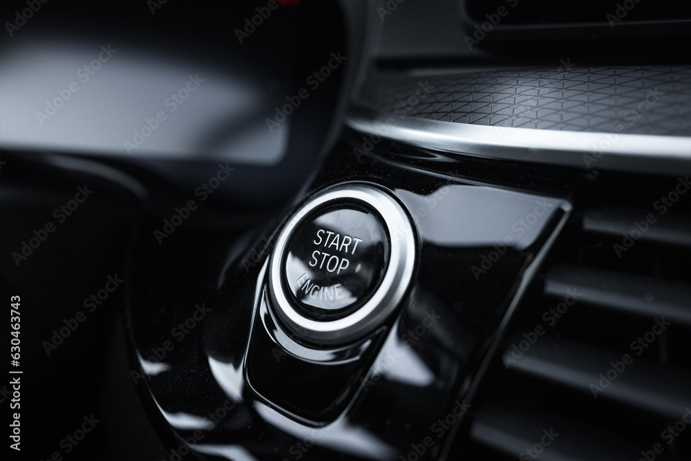A vehicle engine start-stop system or launch button. Turn on or turn ...