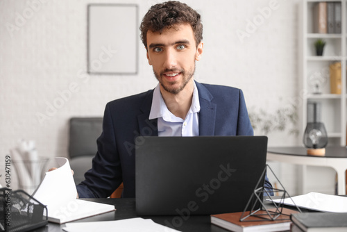 Young entrepreneur working ...