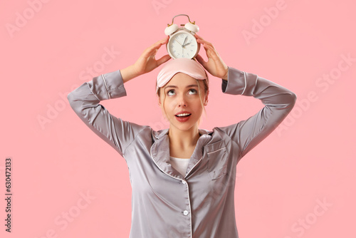 Young woman in pajamas with...