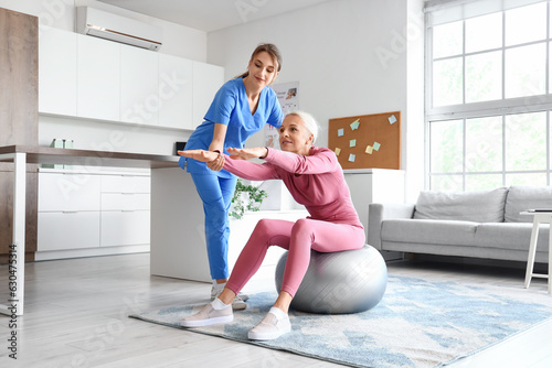 Female physiotherapist work...