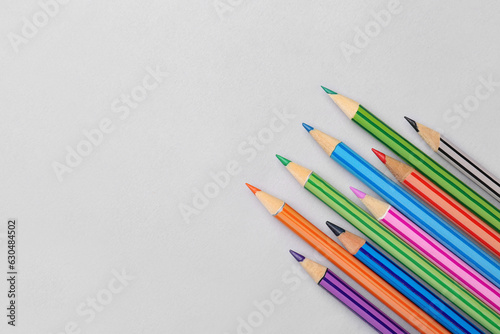 Set of color pencils on light background