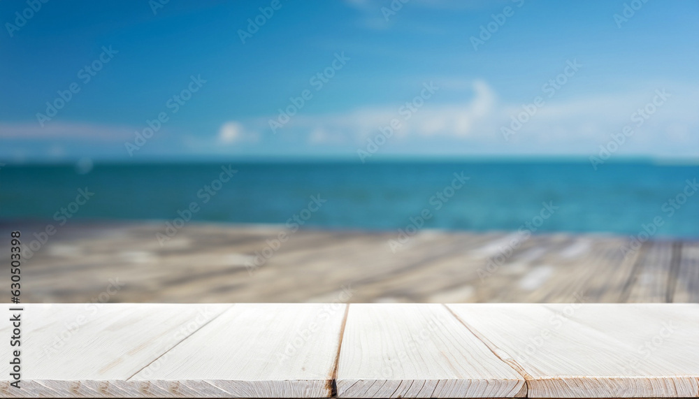 White wood table top on blur sea background