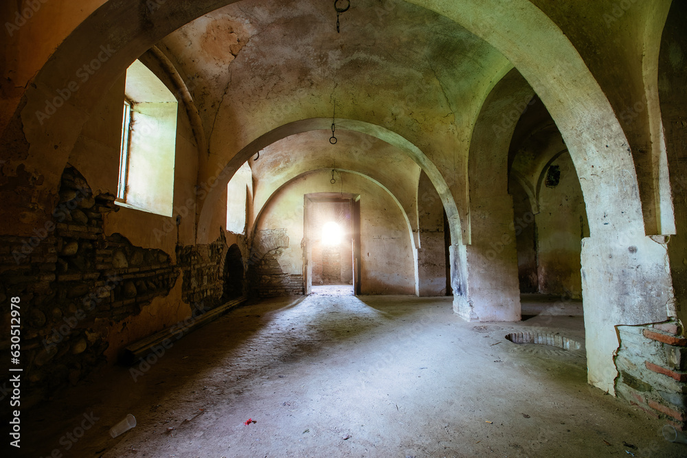 Old vaulted basement under abandoned castle