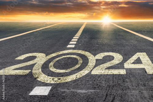 happy new 2024 year tyre track mark on asphalt as a metaphor for moving forward calender in happy new year background for greeting card design top slide cover calendar