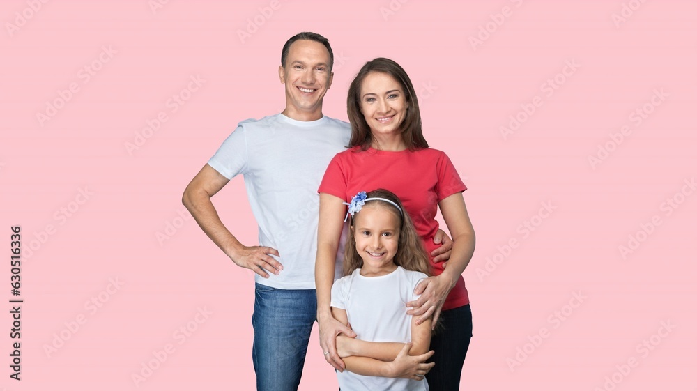 Young parents with child posing together on background Young parents with child posing together on background