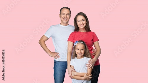 Young parents with child posing together on background