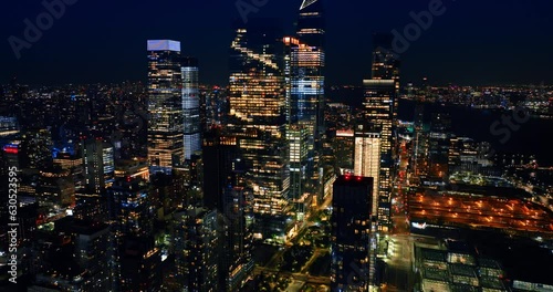 Rising to the tops of magnificent skyscrapers. Amazing New York full of lights at night. Top view panorama.