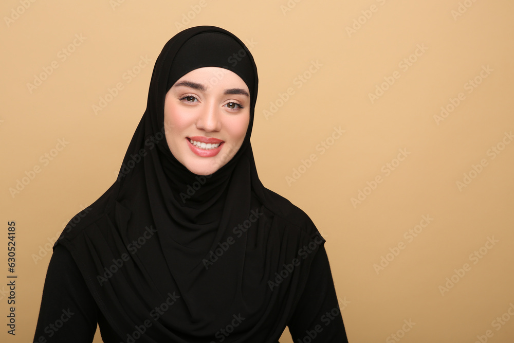 Portrait of Muslim woman in hijab on beige background. Space for text Portrait of Muslim woman in hijab on beige background. Space for text