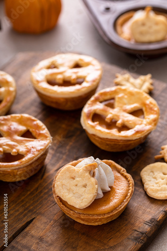 Mini pumpkin pies for Halloween topped with Jack o Lanterns