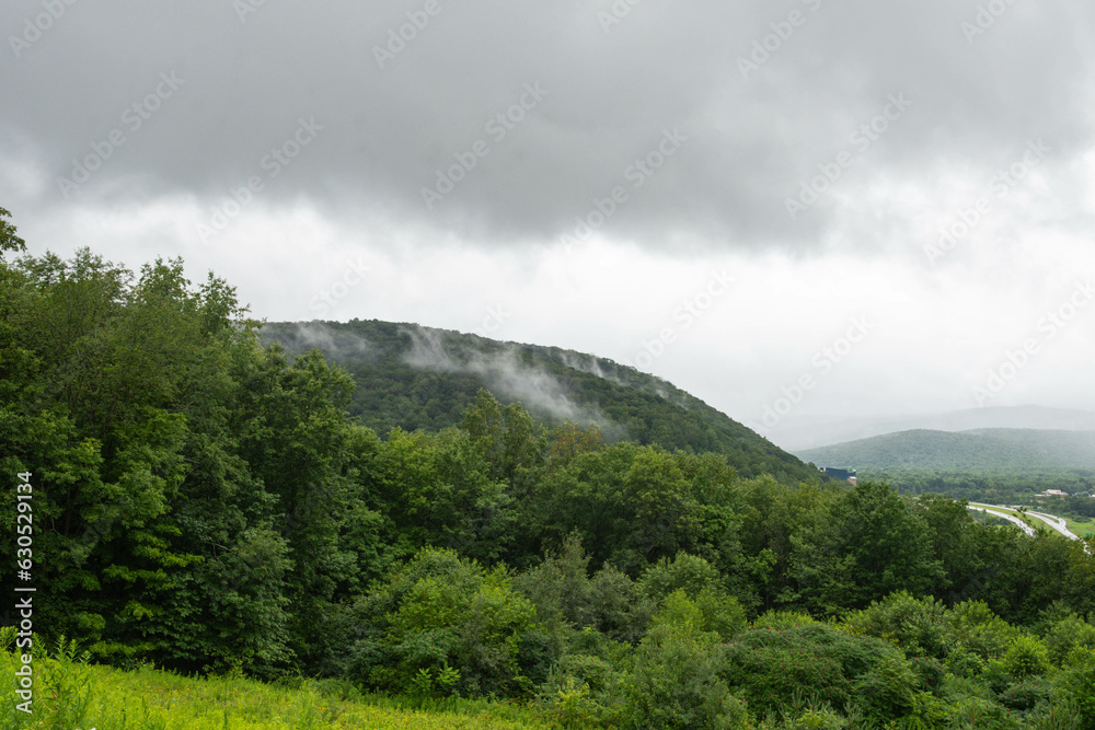 Valley town USA during rainy day, copy space landscape backgrounds, bad weather theme Valley town USA during rainy day, copy space landscape backgrounds, bad weather theme