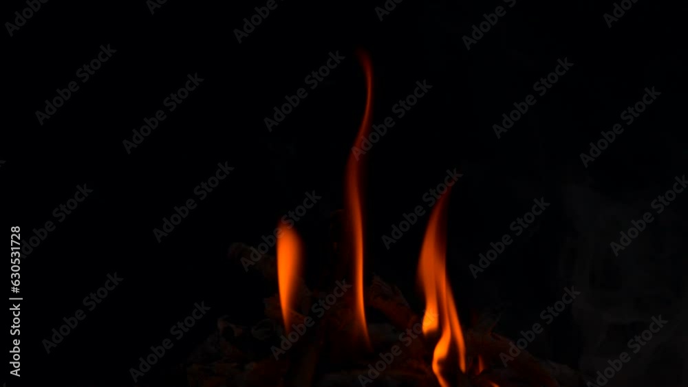 slow motion fire flame burning and glowing on dark black screen slow motion fire flame burning and glowing on dark black screen