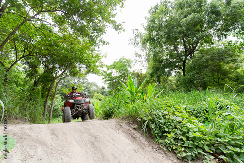 man riding atv vehicle on off road track ,people outdoor sport activities theme.