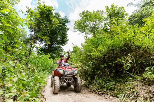 Summer Activities for adults - a trip on quad bikes on the dirt road. © 2B