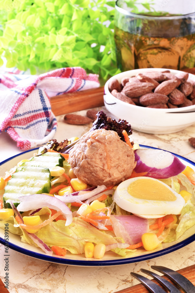 Tuna salad with corn, lettuce, red onions, boiled egg, radish, cucumber and canned tuna. Tuna salad with corn, lettuce, red onions, boiled egg, radish, cucumber and canned tuna.