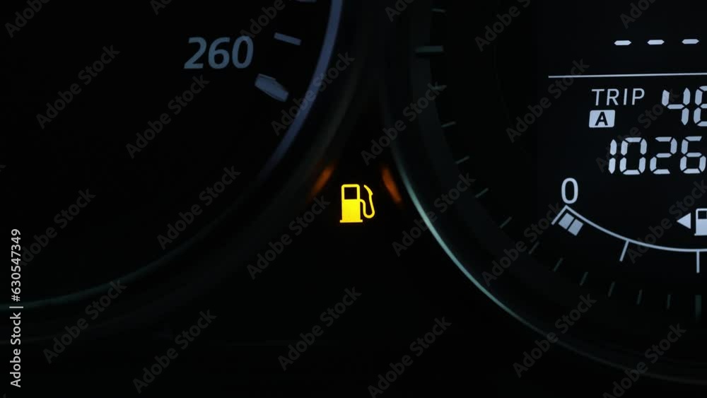 Empty fuel warning light in car dashboard. Fuel pump icon. gasoline