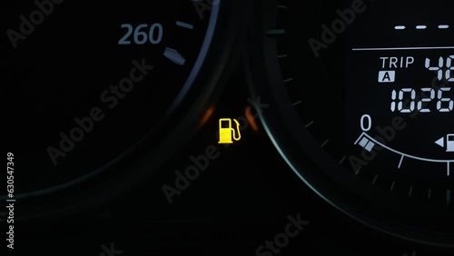 Empty fuel warning light in car dashboard. Fuel pump icon. gasoline gauge dash board in car with digital warning sign of run out of fuel turn on. Low level of fuel show on speedometer dashboard.