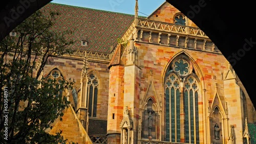 Large Roman Catholic St Martin's Church with Gothic architecture in Colmar. Old medieval stone building church with medieval statues in Colmar Town in the Grand Est of France photo