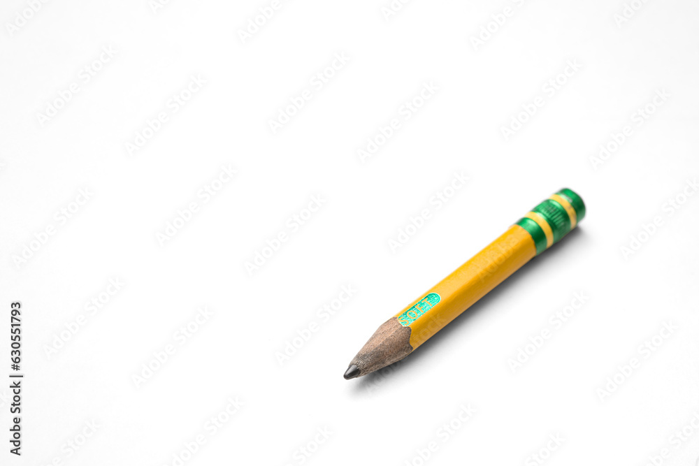 Well worn Used up Short No.2 Yellow Pencil Isolated with Transparent shadow at an angle
