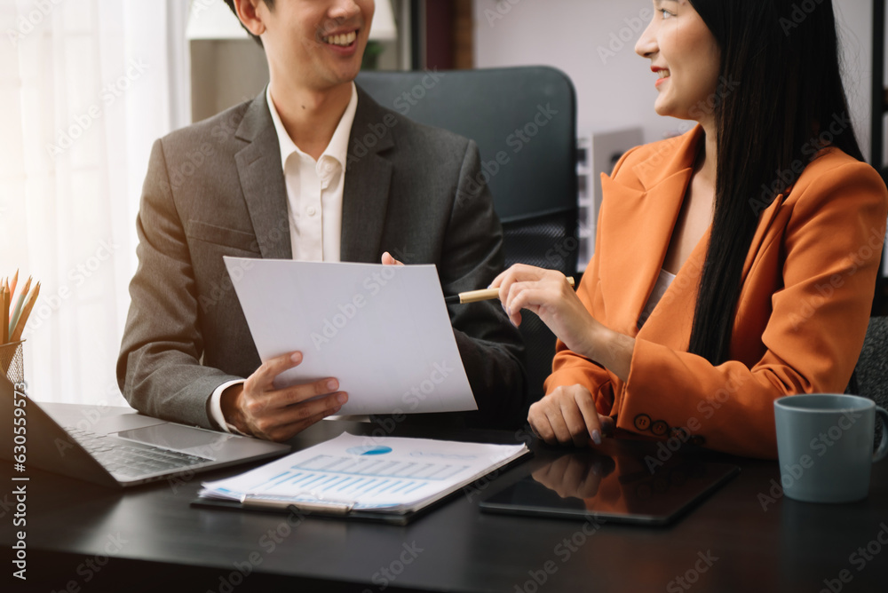 Businessman and team analyzing financial statement Finance task. with smart phone and laptop and tablet. Wealth management concept Businessman and team analyzing financial statement Finance task. with smart phone and laptop and tablet. Wealth management concept