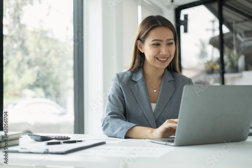 Asian businesswomen sit at their desks and calculate financial graphs showing results about their investments, planning successful business growth process Free Download Asian businesswomen sit at their desks and calculate financial graphs showing results about their investments, planning successful business growth process - GFXLoad