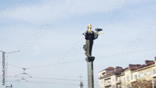 Low angle shot of Santa Sofia statue in the city center in Sofia, Bulgaria on a sunny day. Historical landmark. photo