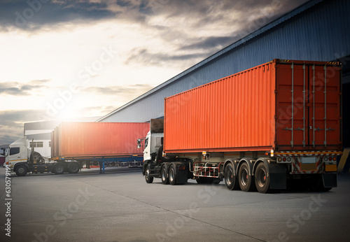 Semi Trailer Trucks on The Parking Lot at Warehouse. Trucks Loading at Dock Warehouse. Shipping Cargo Container Delivery Trucks. Distribution Warehouse. Freight Trucks Logistic, Cargo Transport.