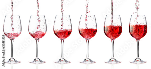 Pouring pink wine into a glass on a white background.