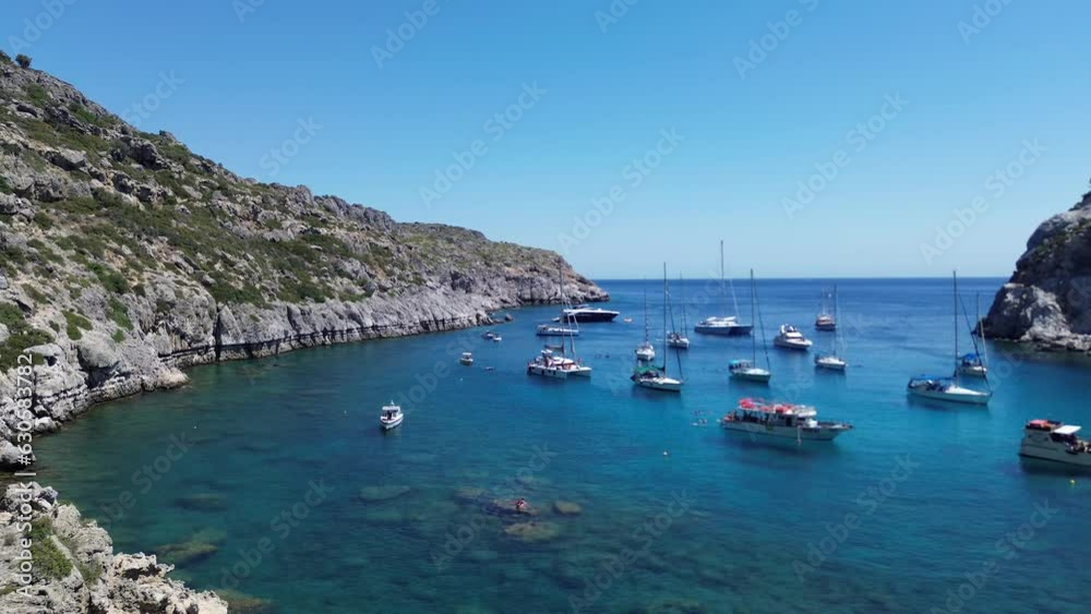 Anthony Quinn Bay in Faliraki, Rhodes in Greece during the day with crystal clear water Anthony Quinn Bay in Faliraki, Rhodes in Greece during the day with crystal clear water