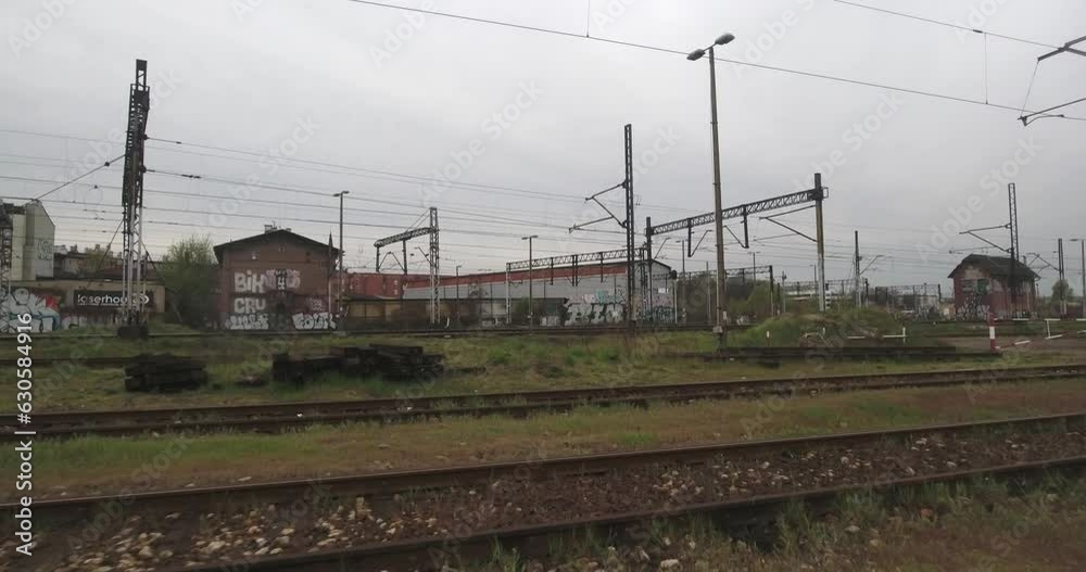 Railway tracks in a city in Central Europe on a cloudy day. Drone shot in 4K resolution. Railway tracks in a city in Central Europe on a cloudy day. Drone shot in 4K resolution.