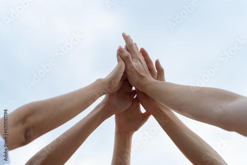 Panoramic Teamwork,empathy,partnership and Social connection in business join hand together concept.Hand of diverse people connecting.Power of volunteer charity work,Stack of people hand.
 photo