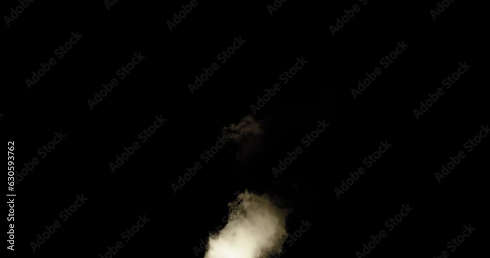 Smoke billowing upwards with pulsating fire light illuminating the mass. Smoke billowing upwards with pulsating fire light illuminating the mass.