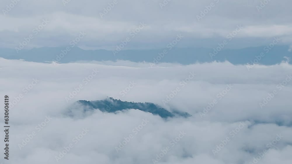 Mountain range with visible silhouettes through the morning colorful fog. Mountain range with visible silhouettes through the morning colorful fog.