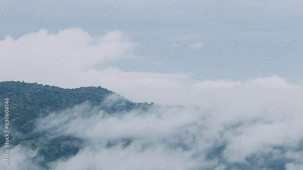 Mountain range with visible silhouettes through the morning colorful fog. Mountain range with visible silhouettes through the morning colorful fog.