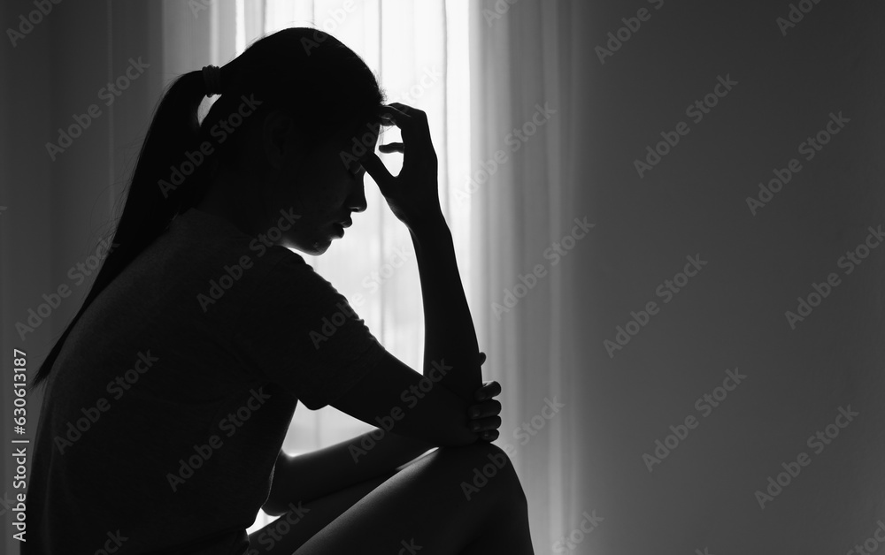 Young  women sitting in dark room feeling pain with life problem.  suffering from husband violence, Stop violence against and sexual abuse women, domestic violence, anti human trafficking. - obrazy, fototapety, plakaty 